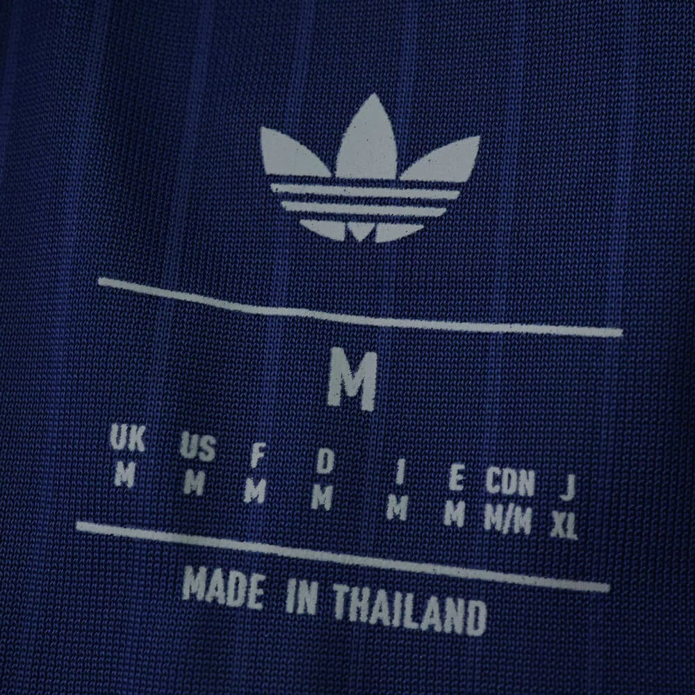 Close-up of the Newcastle United Third 2025/26 Player Version shirt tag showing size and Adidas logo.