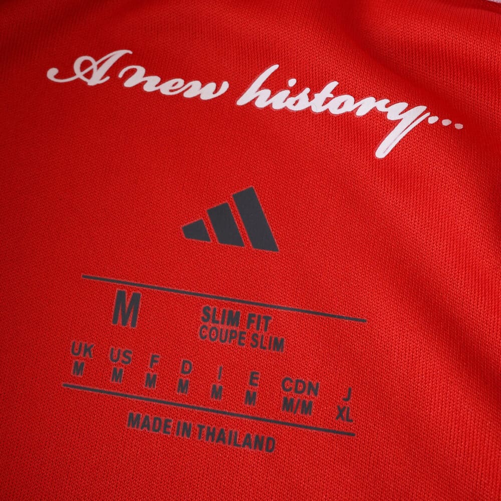 Close-up of Nottingham Forest 2025/26 Home Fan Version jersey label with "A new history..." text.