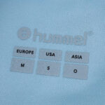 Close-up of Real Betis Away 2025/26 Fan Version shirt label showing Hummel logo and size information.