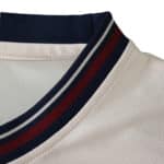 Close-up of the West Ham United 2025/26 Away Fan Version jersey collar, featuring navy and claret stripes.