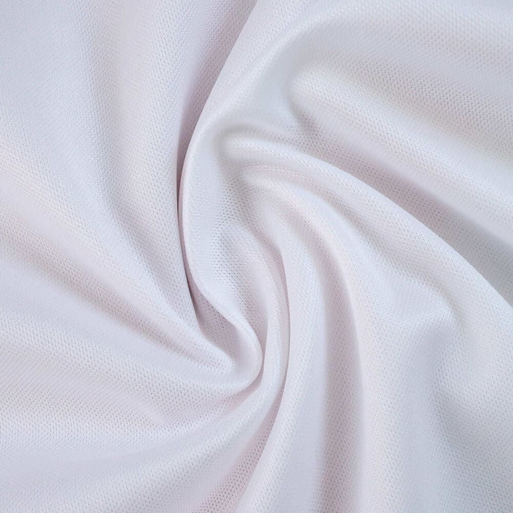 Close-up of white fabric used for the AS Monaco Home 2025/26 Fan Version jersey, showing texture and weave.