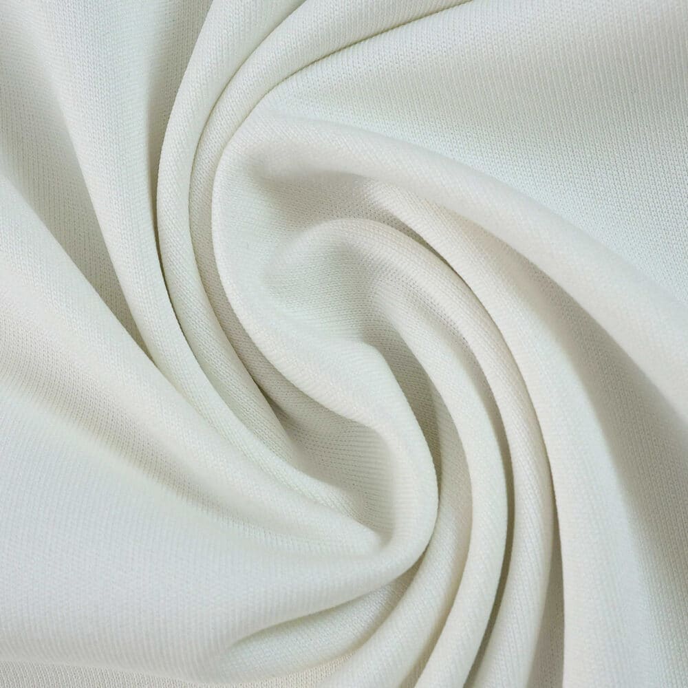 Close-up of the 2025/26 Aston Villa Third Fan Version jersey fabric in light cream color.