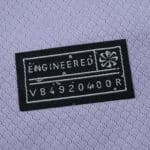 Close-up of the "Engineered" label on the Brighton & Hove Albion 2025/26 away fan jersey.