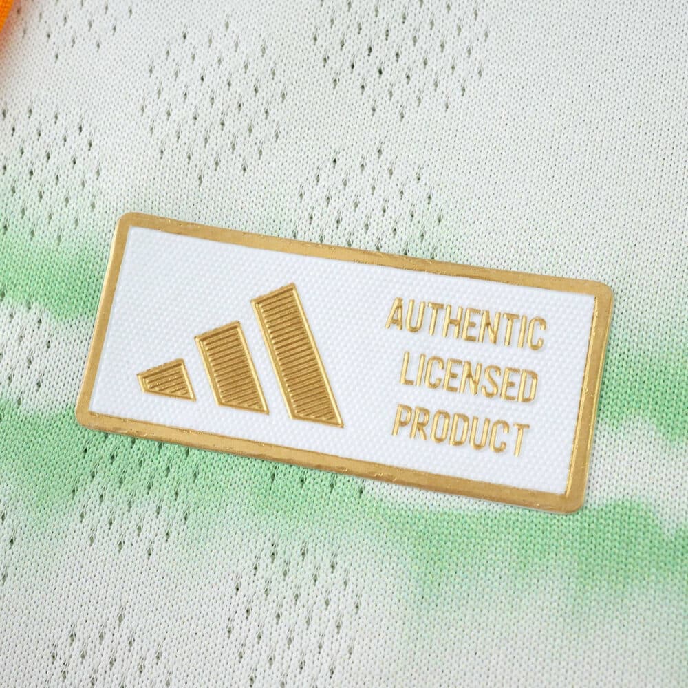 Close-up of the "Authentic Licensed Product" badge on the Celtic Third 2025/26 Player Version jersey.