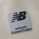 Close-up of New Balance "Authentic Licensed Product" label on FC Porto Third 2025/26 Fan Version shirt.