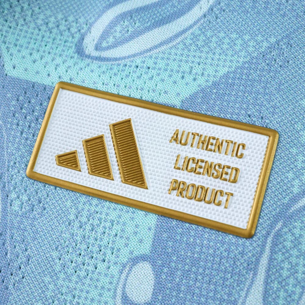 Close-up of Authentic Licensed Product badge on Juventus Away 2025/26 Player Version jersey.