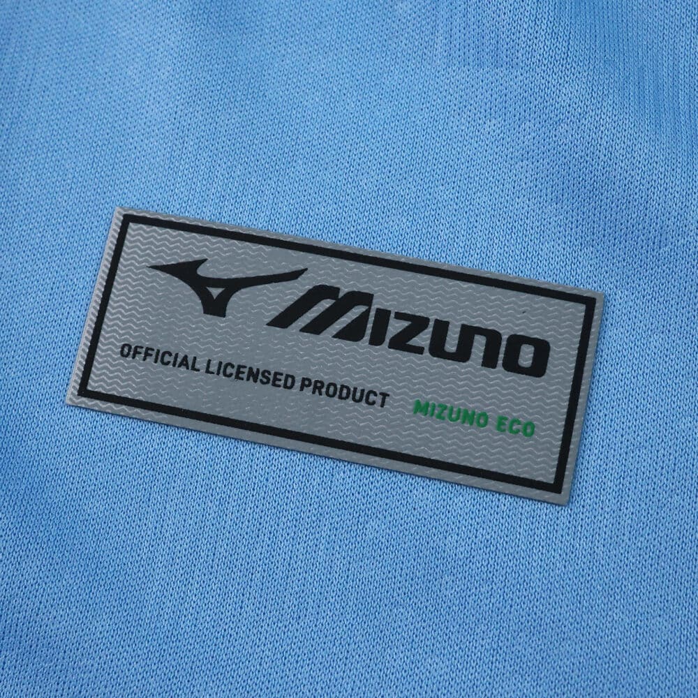 Close-up of Mizuno logo and official licensed product label on Lazio Home 2025/26 Fan Version jersey.