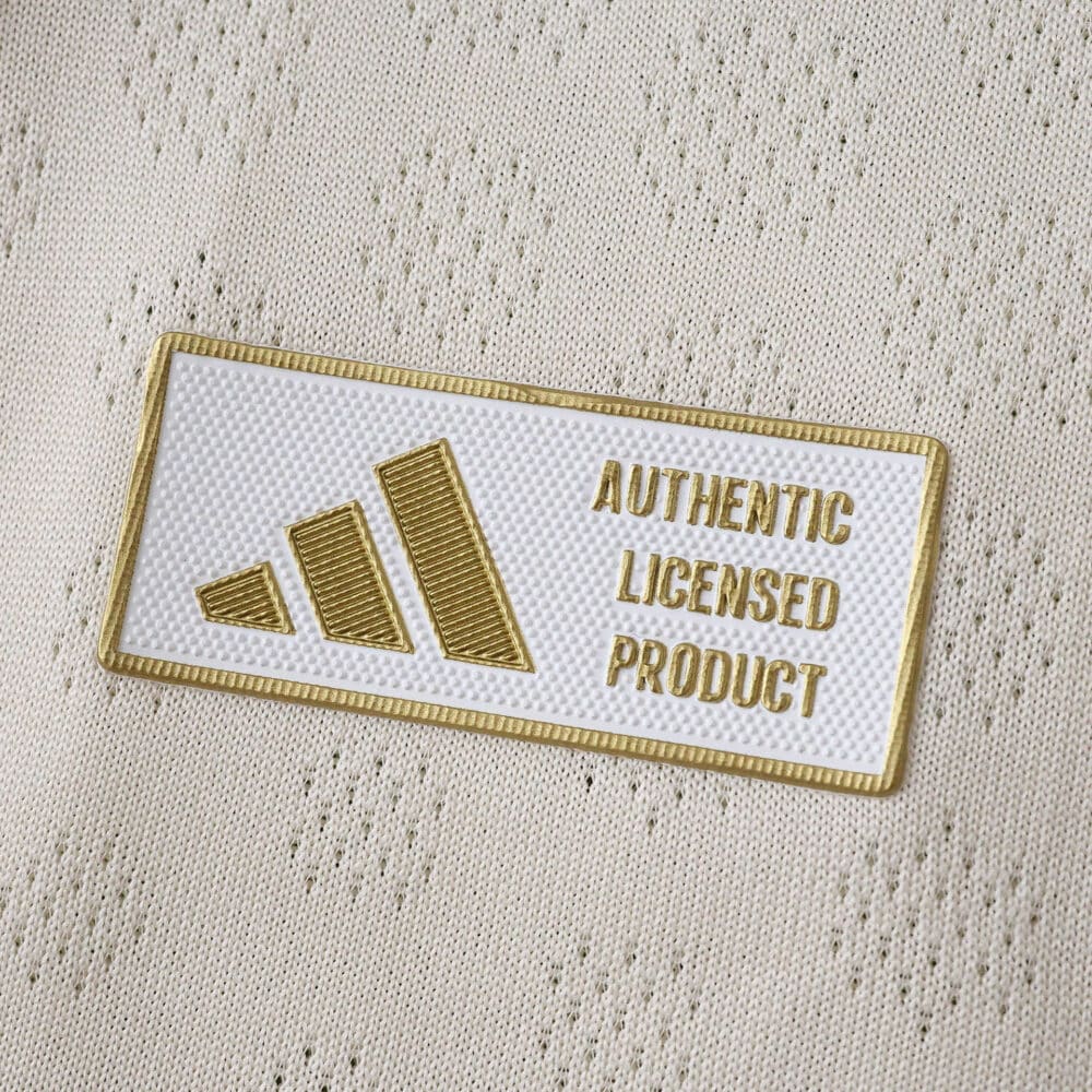 Gold Adidas "Authentic Licensed Product" badge on the Liverpool Away 2025/26 Player Version jersey fabric.