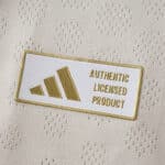 Gold Adidas "Authentic Licensed Product" badge on the Liverpool Away 2025/26 Player Version jersey fabric.