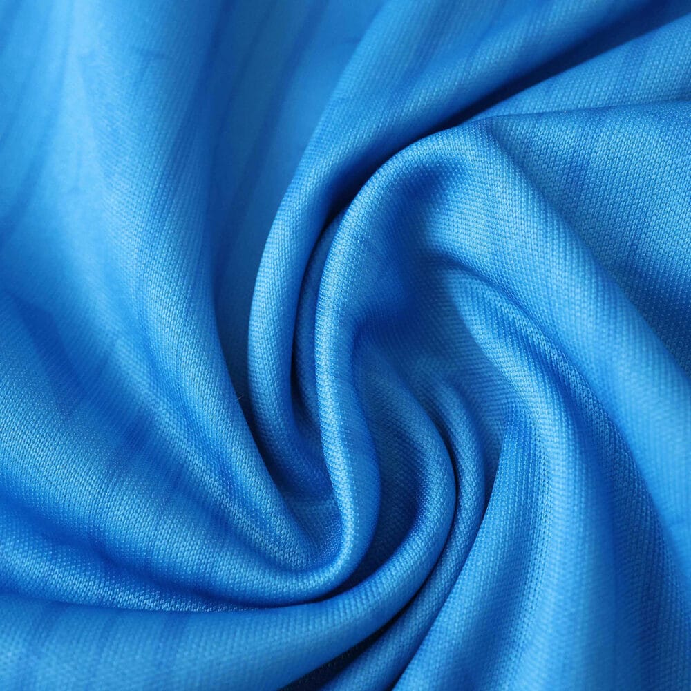 Close-up of blue Napoli Home 2025/26 Fan Version jersey fabric with subtle diagonal lines.