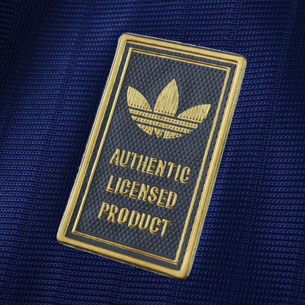 Close-up of the Newcastle United 2025/26 Third Player Version authentic licensed product badge.