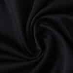 Close-up of black Sevilla FC Third 2025/26 Fan Version jersey fabric with visible texture.