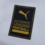Close-up of the Valencia Home 2025/26 Fan Version jersey showing the Authentic Licensed Football Puma badge.