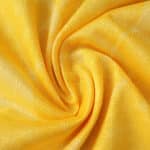 Close-up of yellow AC Milan Third 2025/26 Player Version jersey fabric, showing texture and detail.