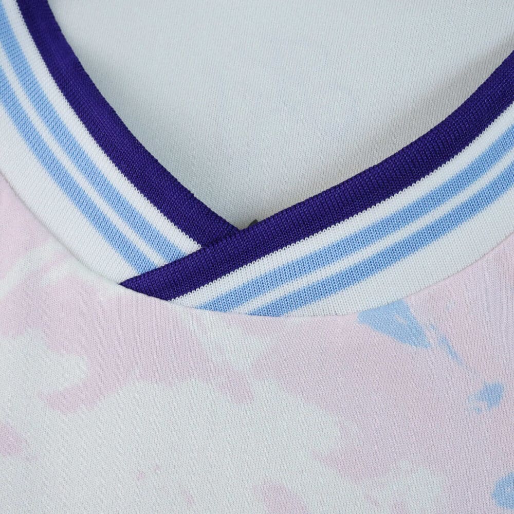 Close-up of Aston Villa Third 2025/26 Fan Version jersey collar with purple and blue stripes.