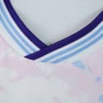 Close-up of Aston Villa Third 2025/26 Fan Version jersey collar with purple and blue stripes.