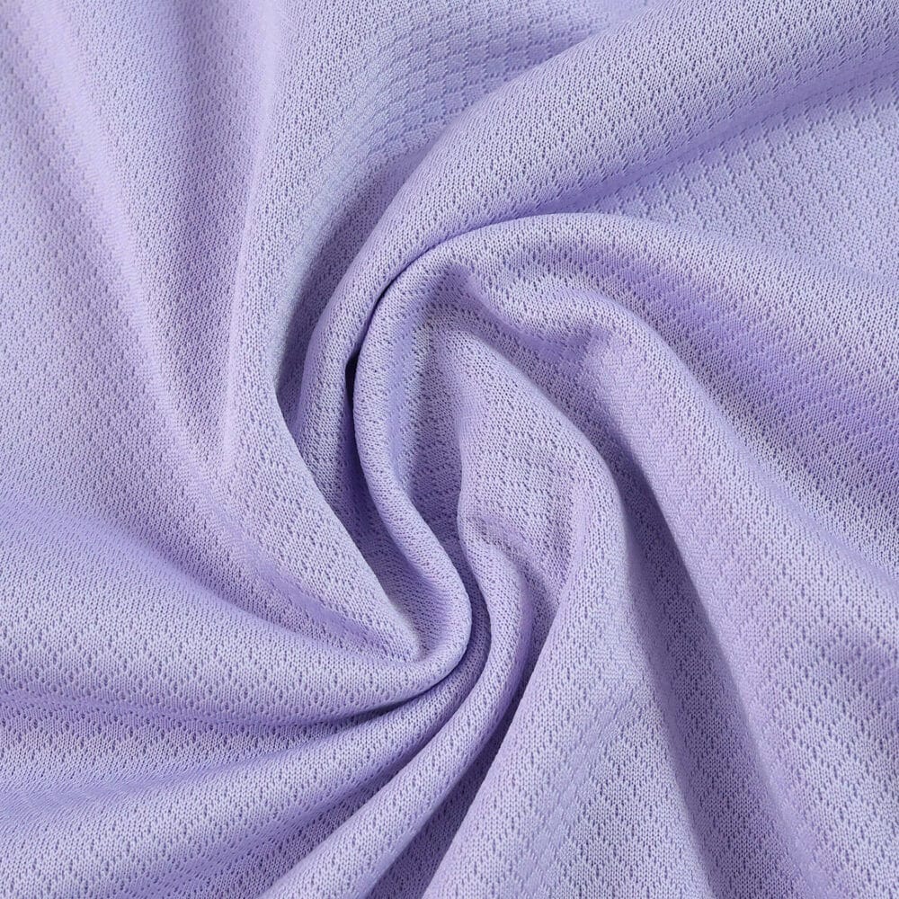 Close-up of the lilac fabric used for the Brighton & Hove Albion Away 2025/26 Fan Version jersey.