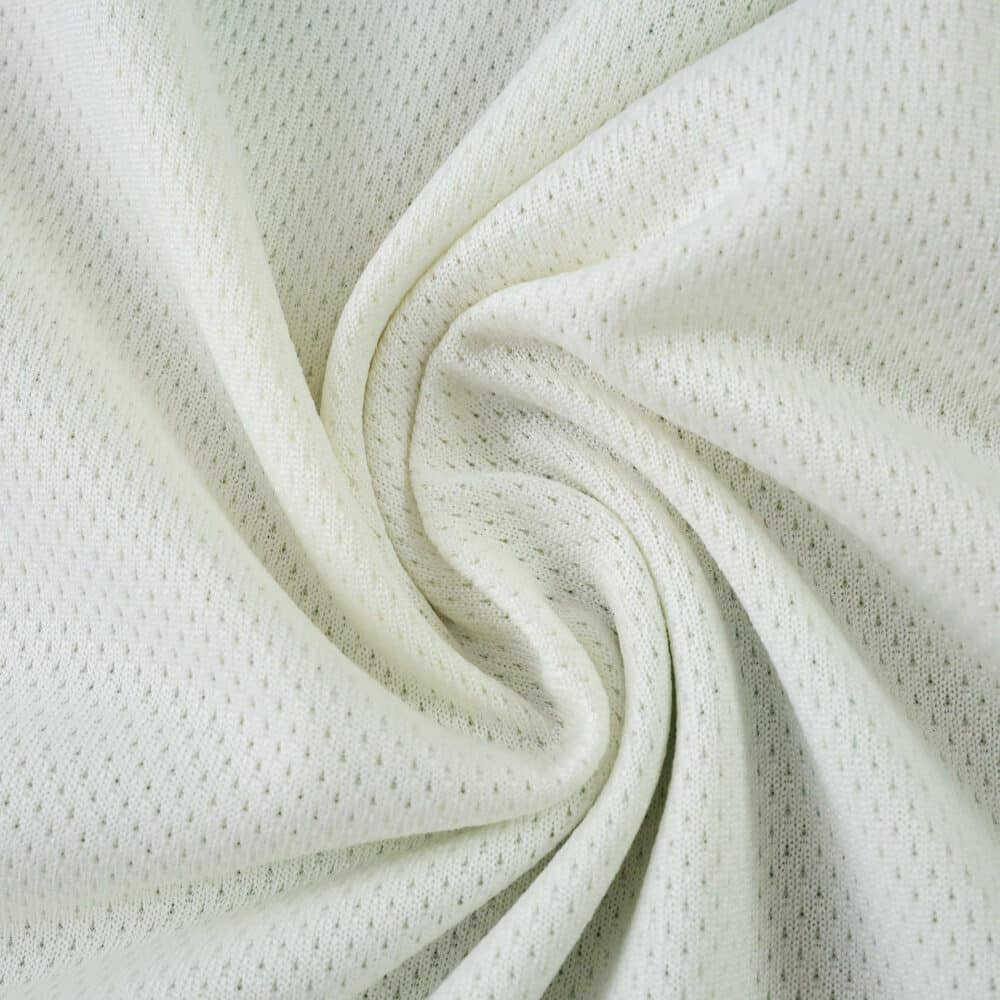 Close-up of the Celtic Third 2025/26 Player Version jersey fabric, showing its light color and breathable texture.