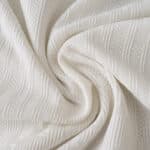 Close-up of FC Porto Third 2025/26 player version fabric in white with textured patterns.