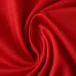 Close-up of vibrant red fabric used for the Granada Home 2025/26 Fan Version jersey.