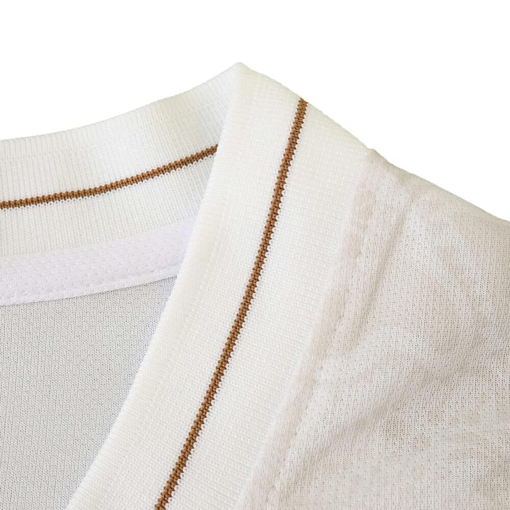 Close-up of the Napoli Away 2025/26 Fan Version collar with gold accent on white fabric.