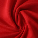Close-up of red fabric detail from the Osasuna Home 2025/26 Fan Version jersey.