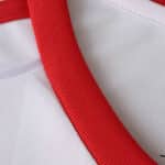Close-up of the red collar detail on the Sevilla FC Home 2025/26 Fan Version jersey.