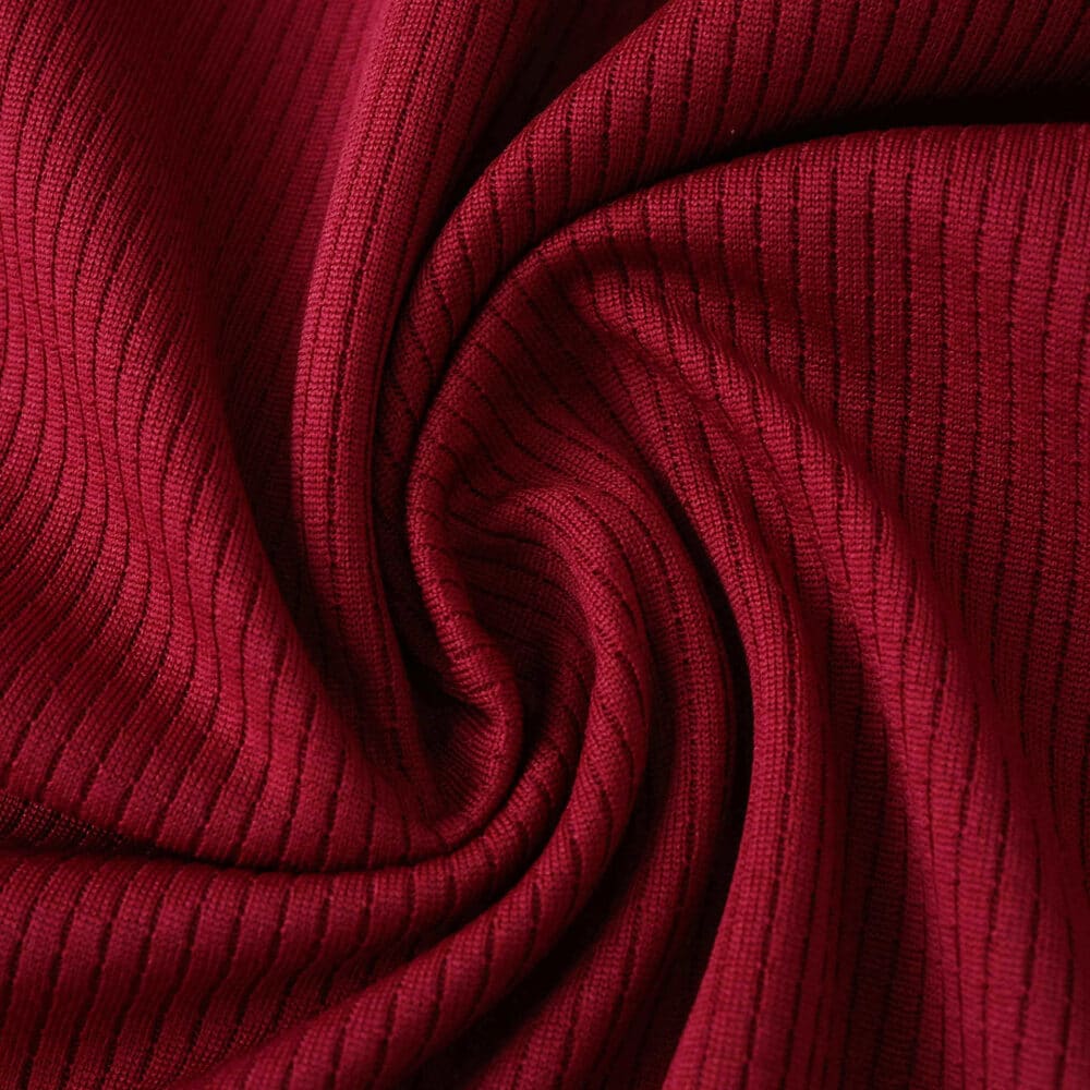 Close-up of the ribbed claret fabric used in the West Ham United 2025/26 Home Player Version shirt.