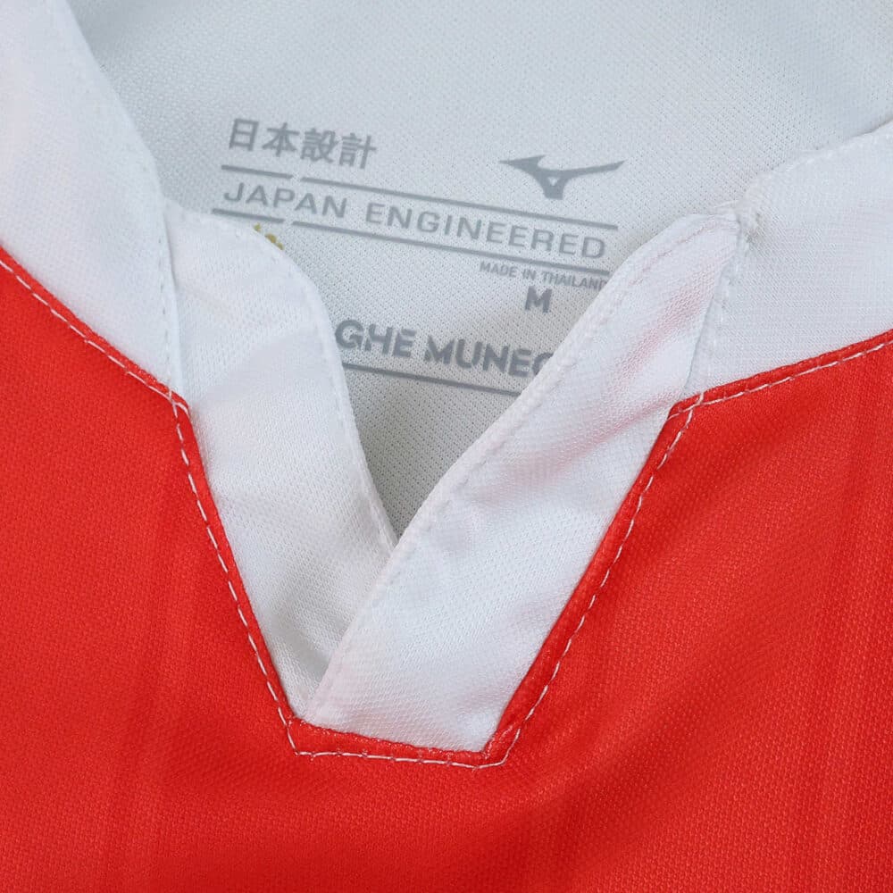 Close-up of AS Monaco 2025/26 home fan jersey collar with white trim and size label inside.