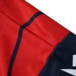 Close-up of the Bologna Home 2025/26 Fan Version jersey showing red and navy blue fabric details.