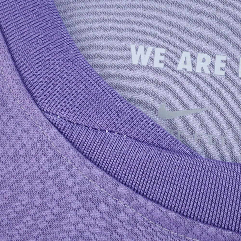 Close-up of the collar on the Brighton & Hove Albion 2025/26 away fan jersey in purple with “WE ARE” text inside.