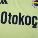 Close-up of Fenerbahce Away 2025/26 Fan Version jersey featuring sponsor and club crest.