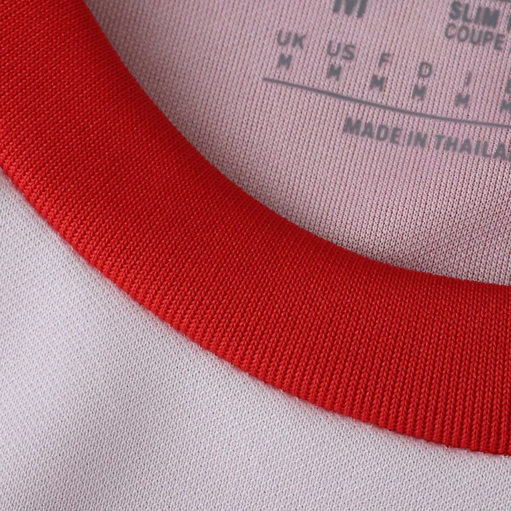 Close-up of the collar on the Granada Home 2025/26 Fan Version jersey, showing red trim and fabric details.