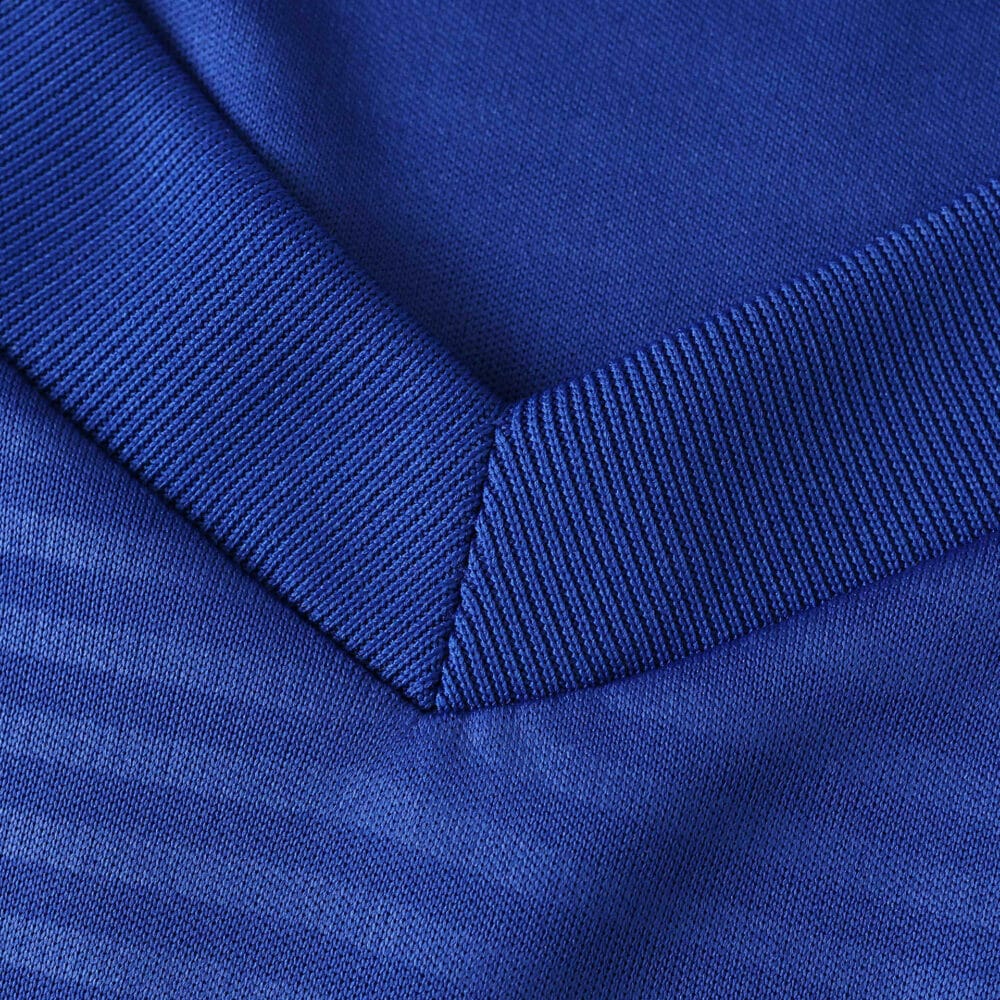 Close-up of the blue collar fabric on the Leeds United Away 2025/26 Fan Version jersey.