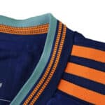 Close-up of Newcastle United Third 2025/26 Player Version collar with teal, orange, and navy stripes.