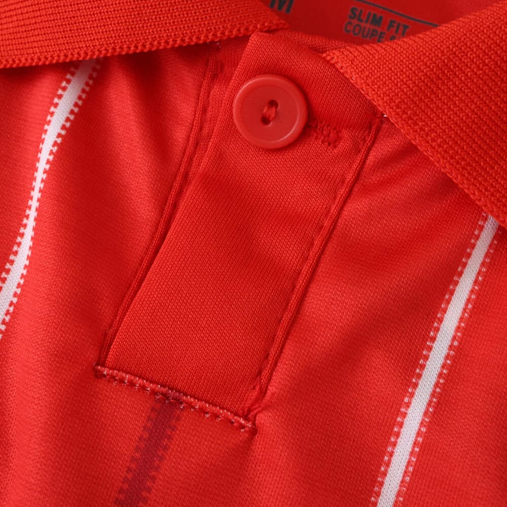 Close-up of the red Nottingham Forest 2025/26 Home Fan Version jersey collar and button detail.