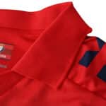 Close-up of the Osasuna Home 2025/26 Fan Version jersey collar in red with navy accents.