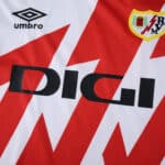 Close-up of Rayo Vallecano 2025/26 home fan jersey featuring club crest, Umbro logo, and DIGI sponsor.