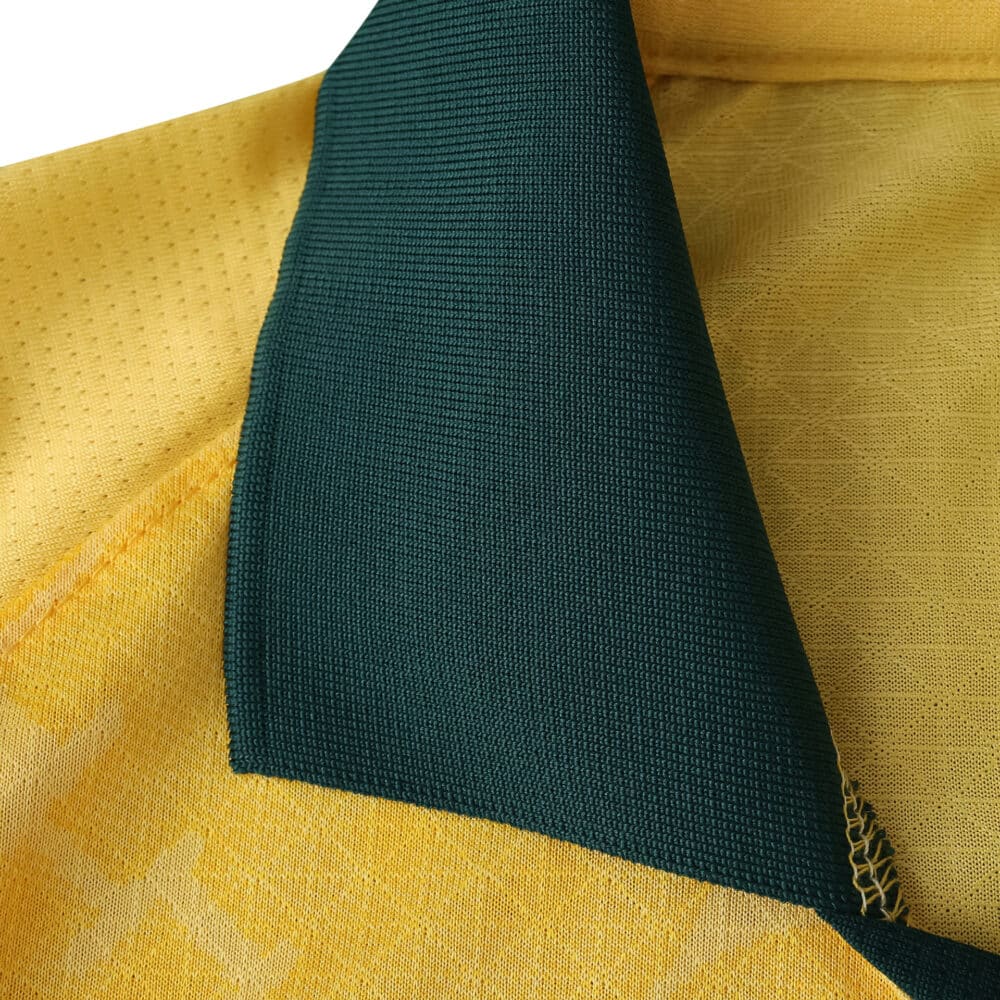 Close-up of AC Milan Third 2025/26 Player Version jersey collar in yellow with green inner lining.