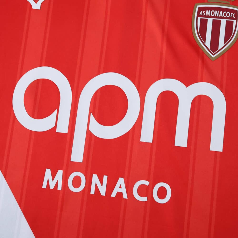 Close-up of the AS Monaco 2025/26 home player jersey featuring sponsor logo and club crest.