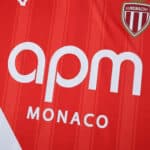 Close-up of the AS Monaco 2025/26 home player jersey featuring sponsor logo and club crest.
