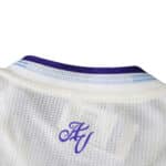 Close-up of the collar on the Aston Villa Third 2025/26 Player Version jersey, showing AV initials.