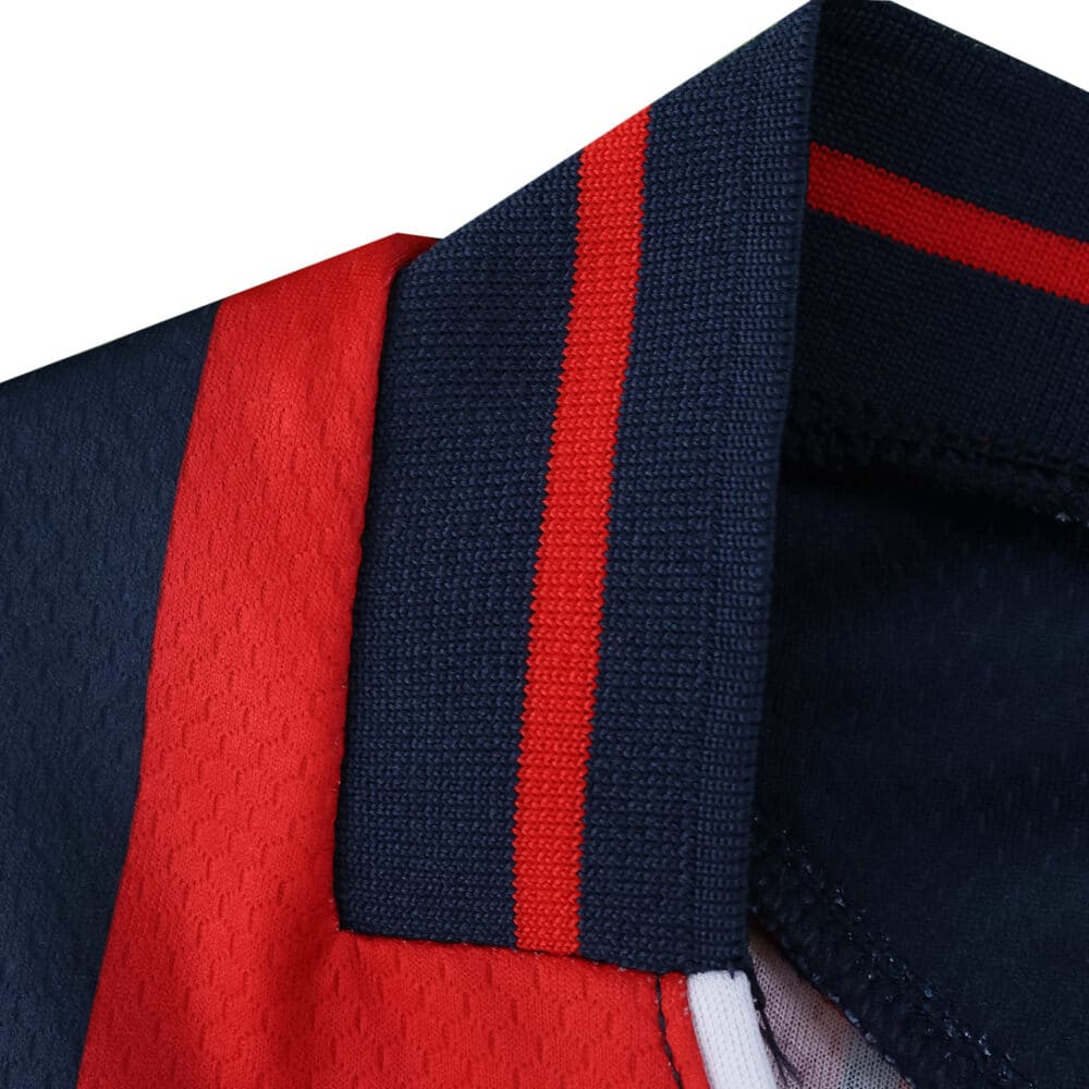 Close-up of the Bologna Home 2025/26 fan jersey collar with navy and red stripe detailing.