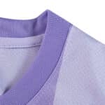 Close-up of the collar on the Brighton & Hove Albion 2025/26 Away Fan Version jersey in light purple.