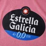 Close-up of Estrella Galicia 0.0 sponsor logo on the pink Celta Vigo Third 2025/26 Fan Version jersey.