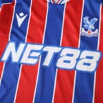 Crystal Palace 2025/26 home fan jersey with blue and red stripes, club crest, and NET88 sponsor logo.