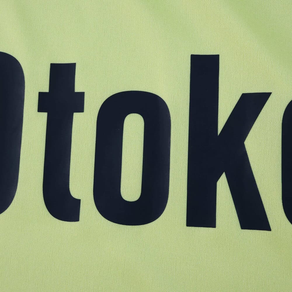 Close-up of the "otok" sponsor text on the Fenerbahce Away 2025/26 Fan Version jersey.