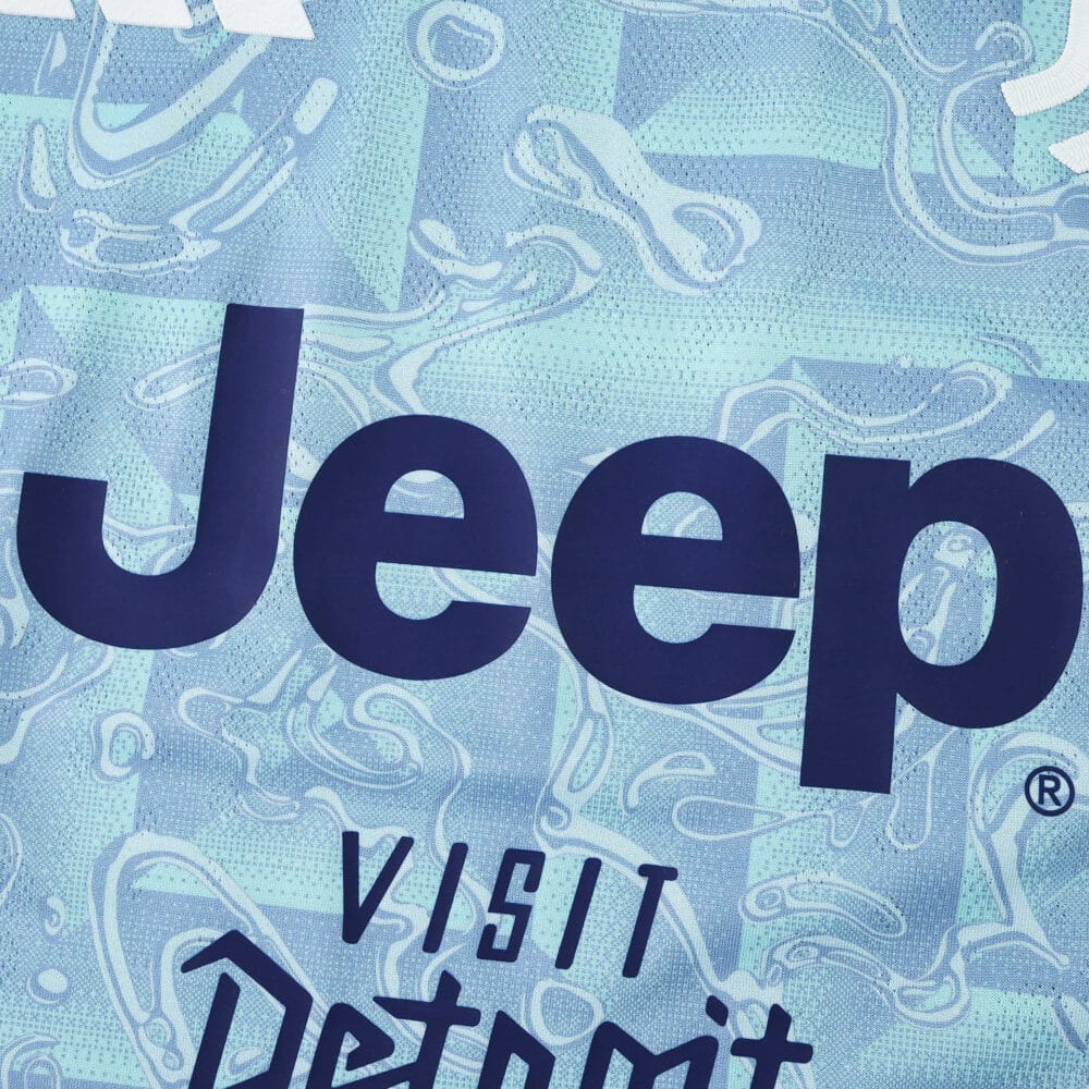 Close-up of the Juventus 2025/26 Away Player Version jersey featuring Jeep and Visit Detroit logos.