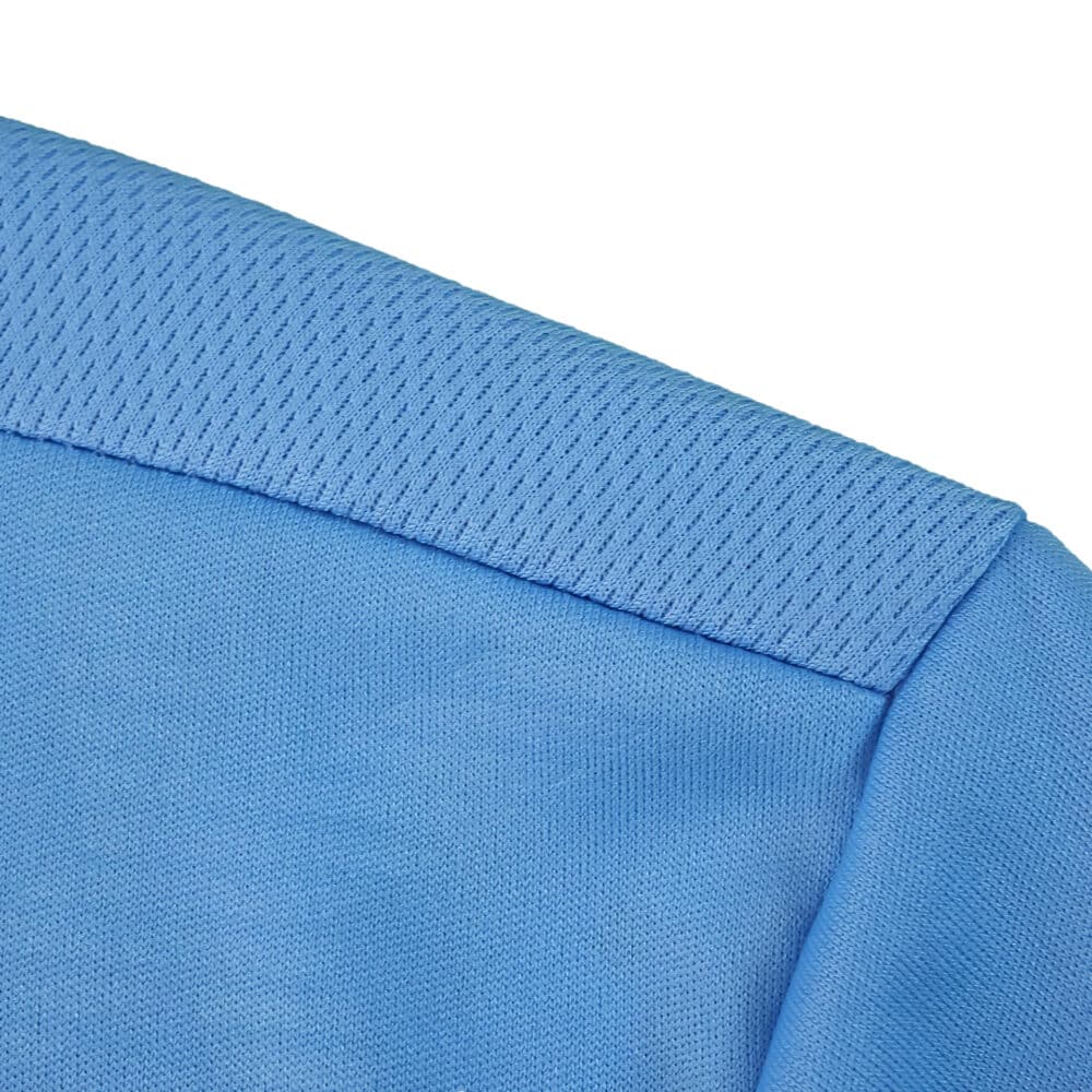 Close-up of the Lazio Home 2025/26 Fan Version jersey collar in light blue fabric.