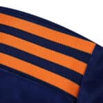 Close-up of Newcastle United Third 2025/26 Player Version shoulder with orange and navy stripes.